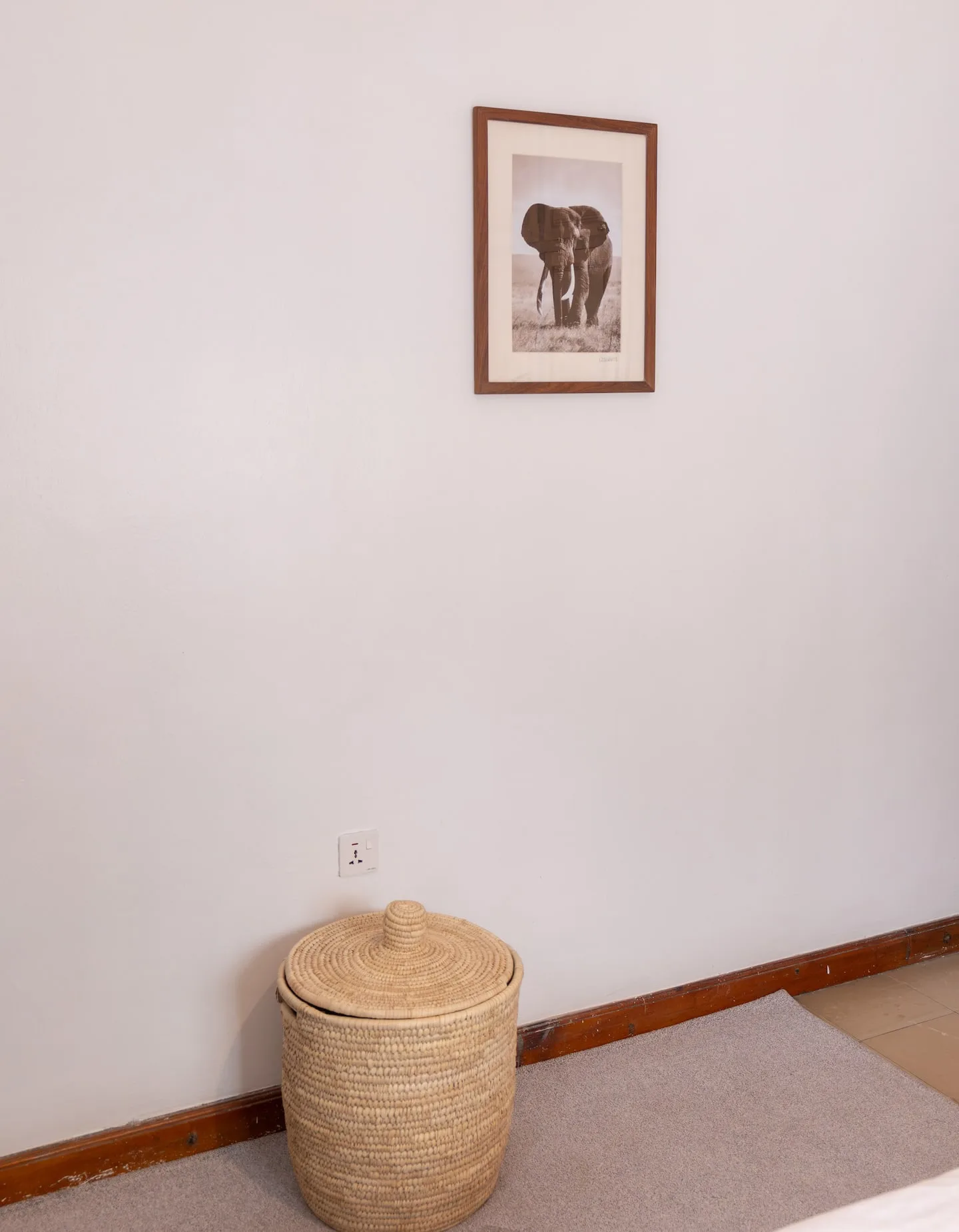 A corner of the living space with framed wall art