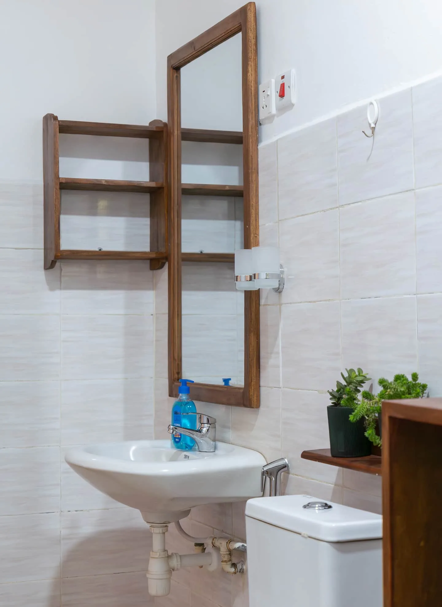 Bathroom with shower fittings and clean tiling