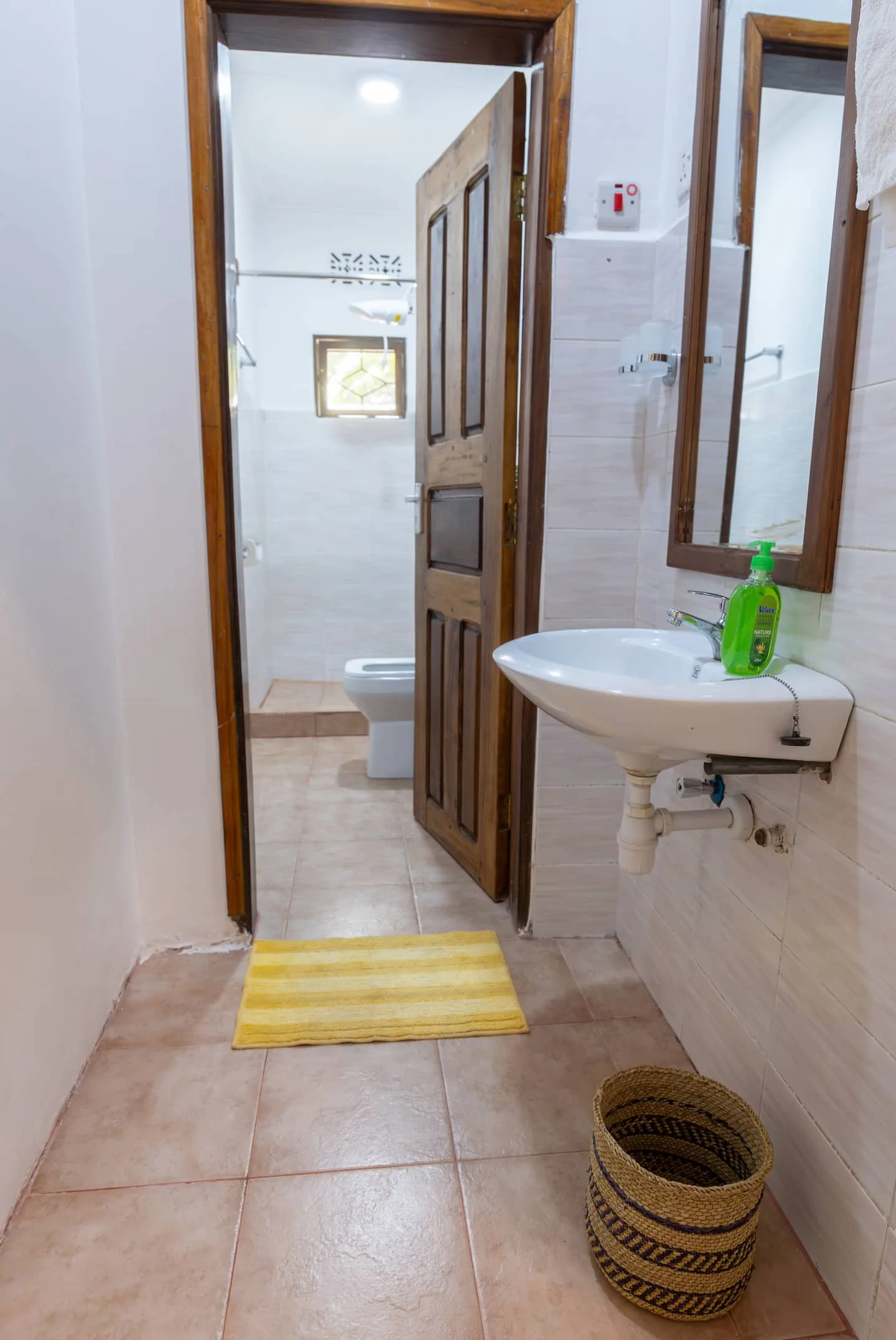 Second bathroom with shower and tiled walls
