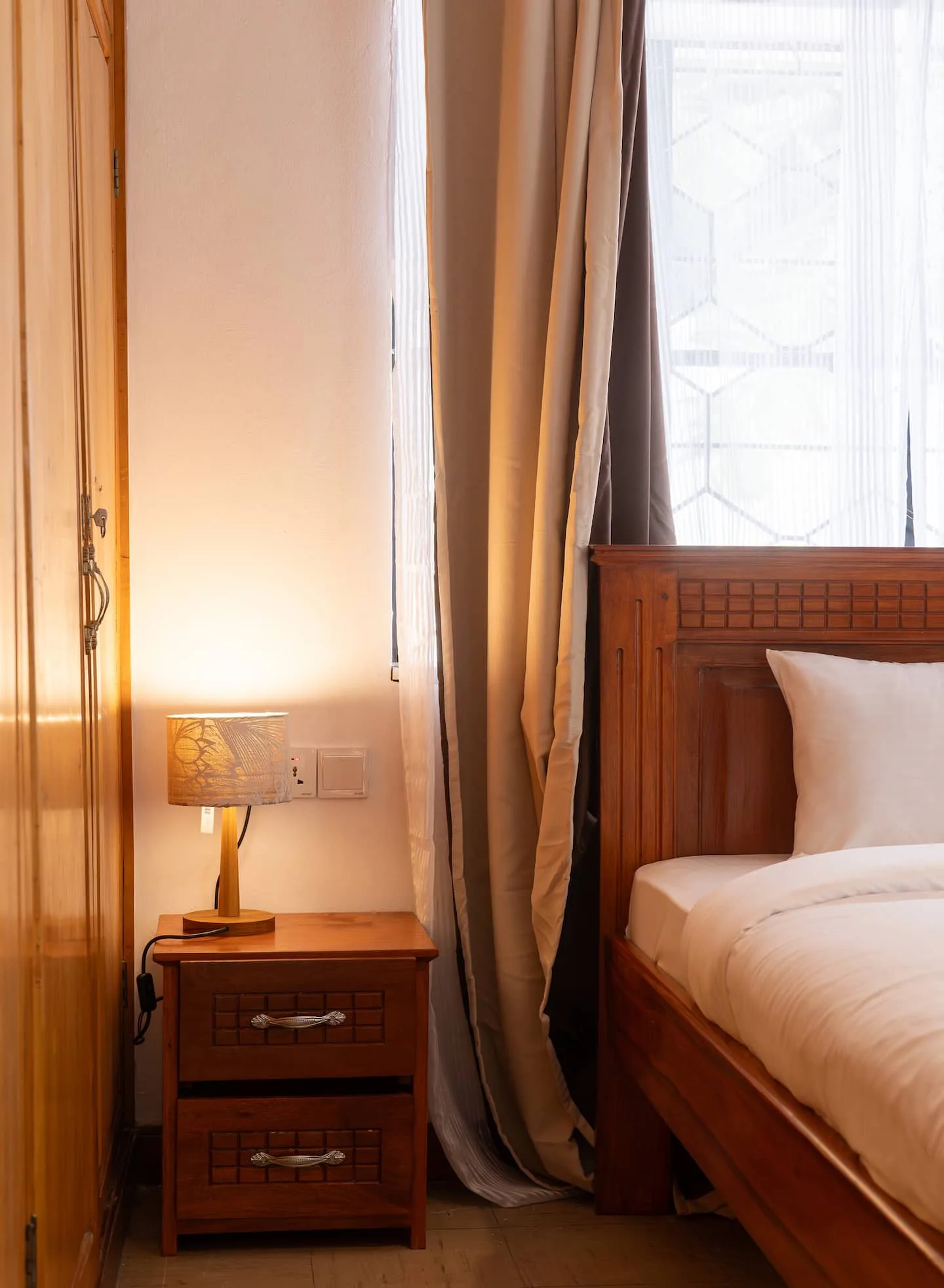 Main bedroom with bedside lighting and a restful feel