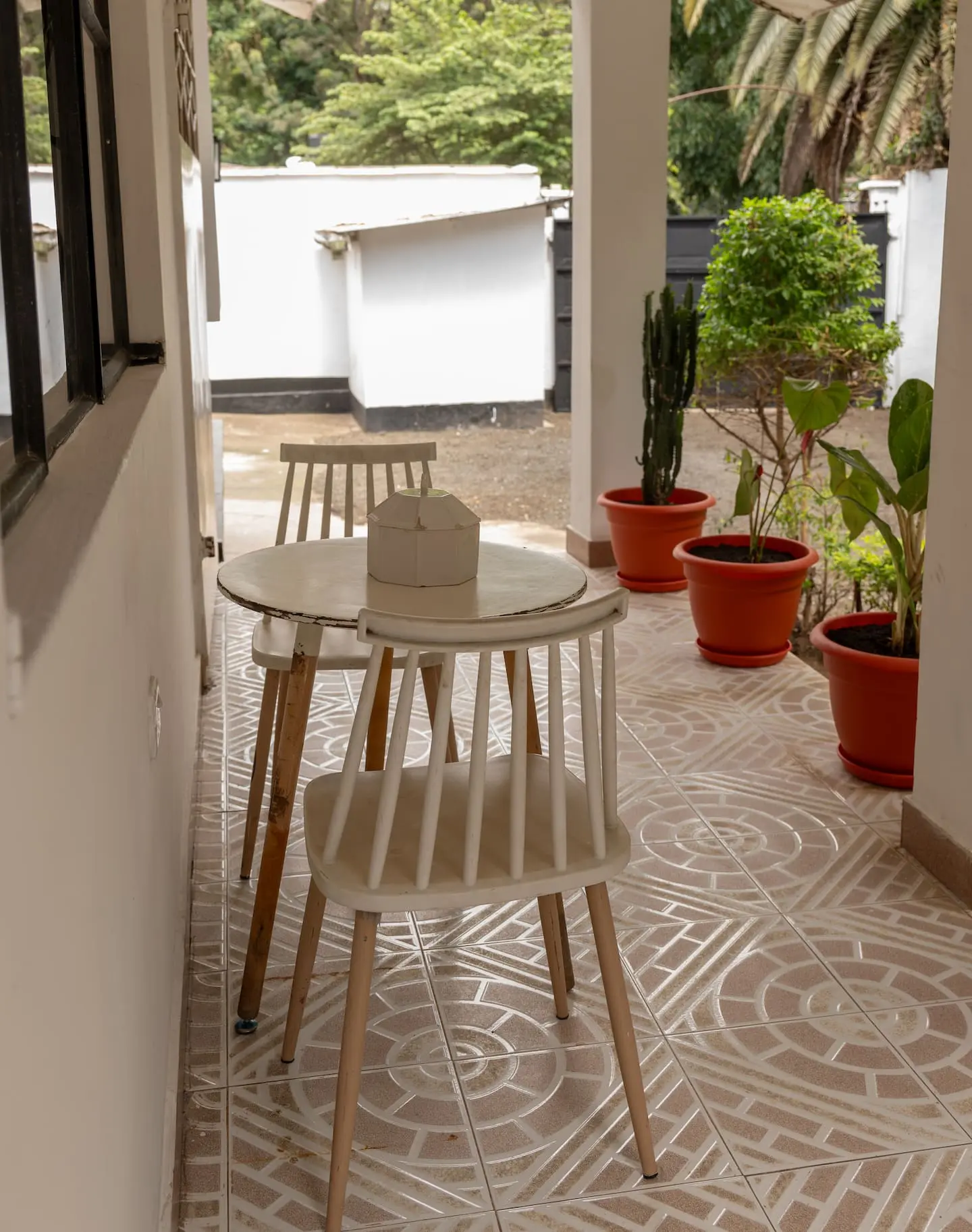 Outdoor seating area surrounded by tropical plants
