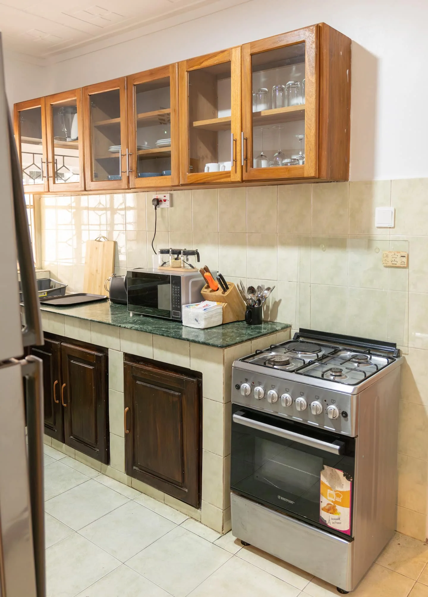 Fully equipped kitchen with cabinets and worktop space