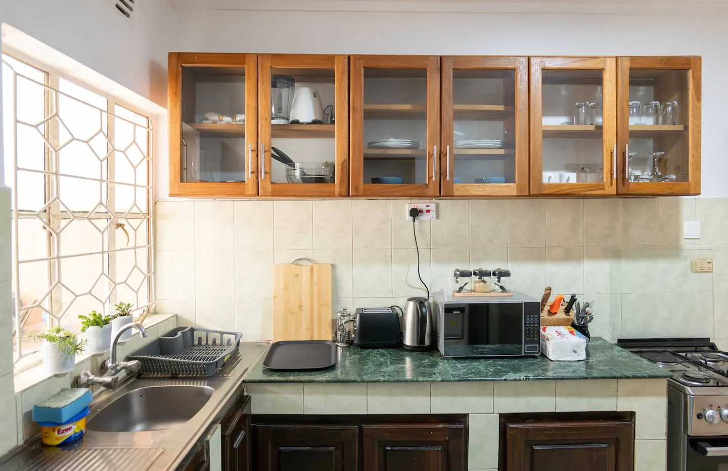 Kitchen counter with appliances and storage