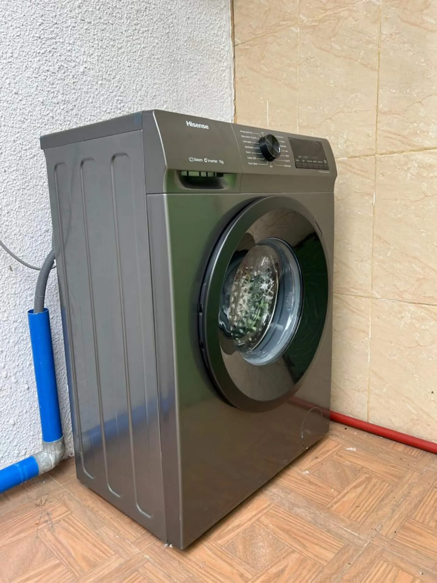 Laundry area with a washer and dryer for guest use